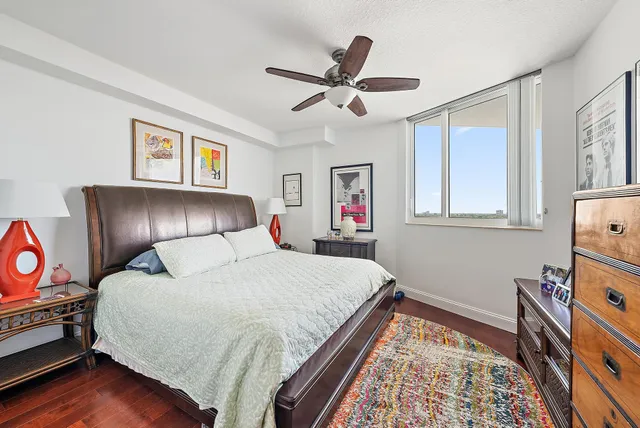 a bathroom with a bathtub shower sink vanity and toilet