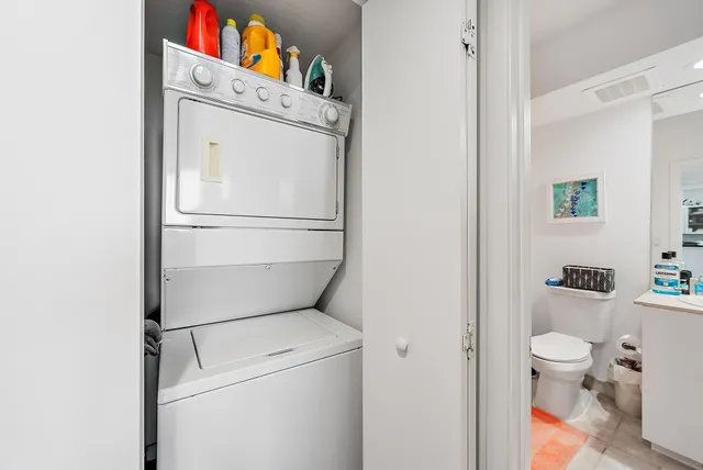 a kitchen with stainless steel appliances granite countertop a sink a stove and a microwave