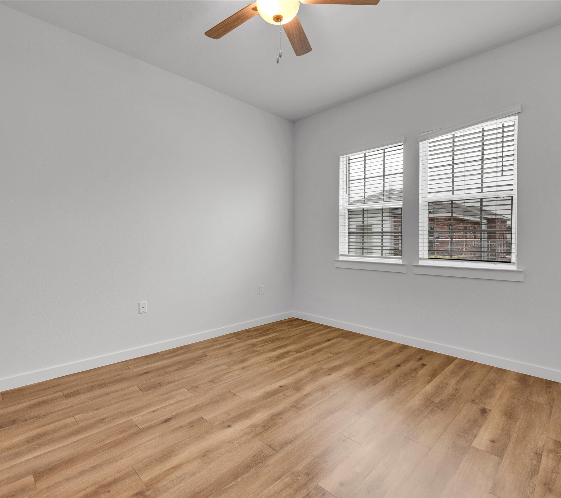 2709-602 Rockhill Road McKinney, TX 75072 - Photo 12 of 19 a view of empty room with wooden floor and fan