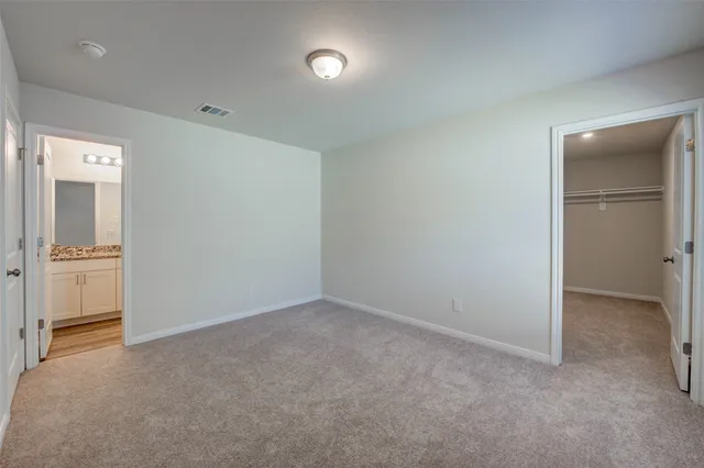 a view of an empty walk in closet