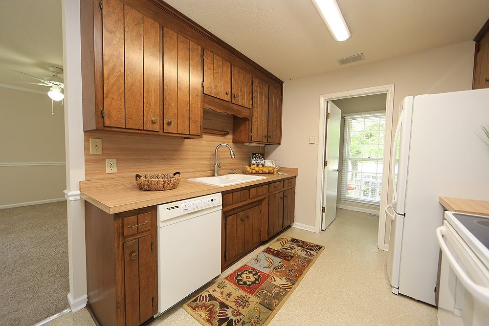 1024 Robinfield Drive Raleigh, NC 27603 - Photo 7 of 26 Wide galley Kitchen provides space for prepping & cooking!