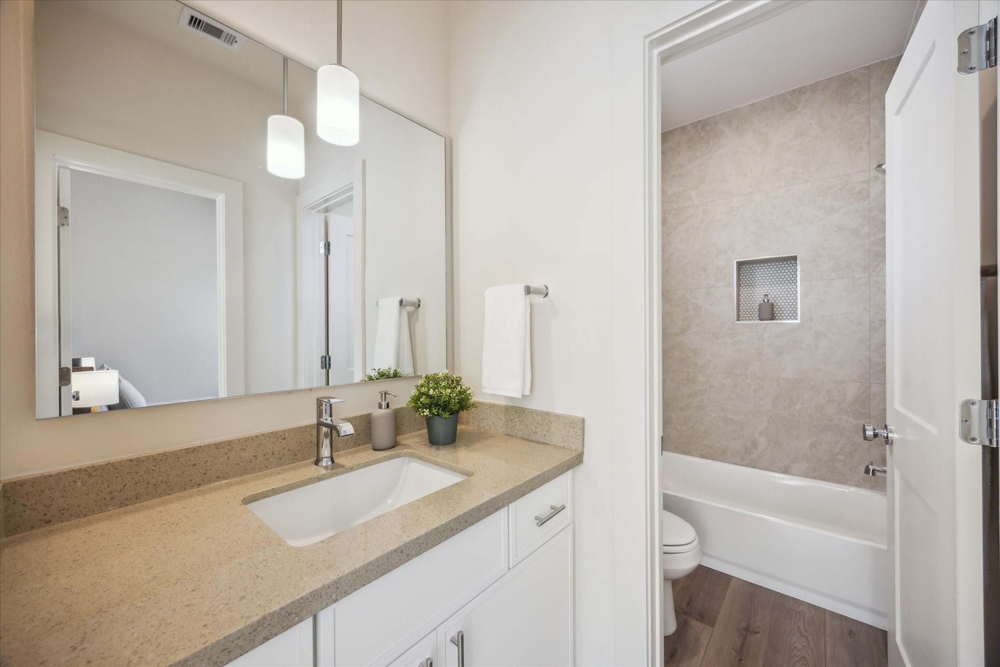 5903 Urban Pines Street Houston, TX 77091 - Photo 21 of 42 a bathroom with a sink and a mirror