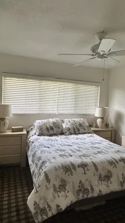 a bedroom with bed and window