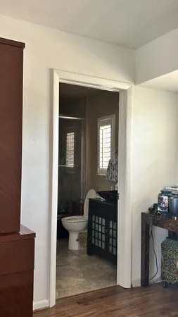 a bathroom with a sink a toilet and a shower