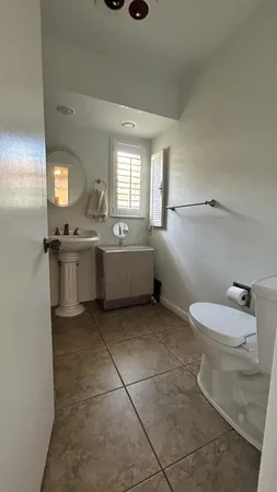 a room with lots of furniture and white walls