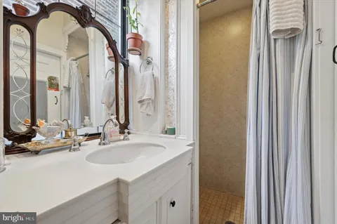 a bathroom with a sink and a mirror