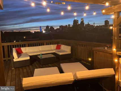 a terrace of a house with outdoor seating