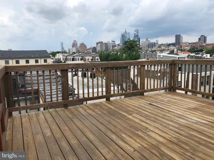 a view of wooden balcony with city view
