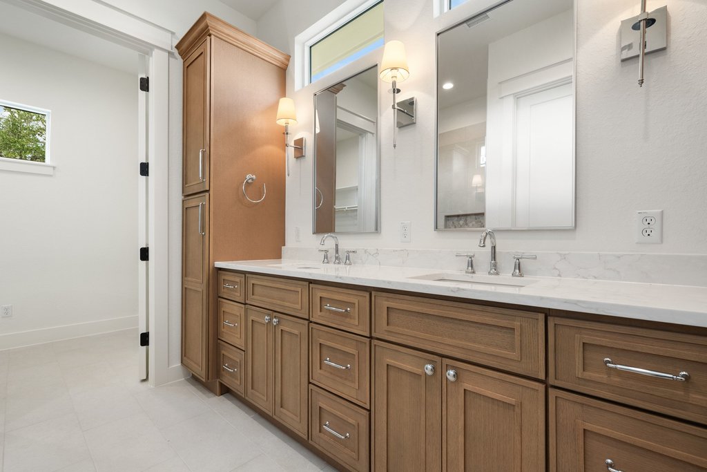 501 Ranchview Drive Johnson City, TX 78636 - Photo 21 of 28 a bathroom with double vanity sinks and a mirror
