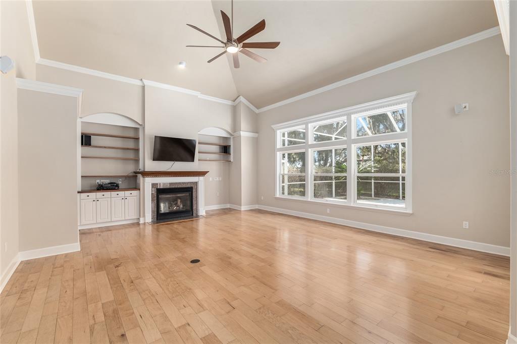 10614 Southwest 15th Lane Gainesville, FL 32607 - Photo 15 of 85 a view of an empty room with a fireplace and a window