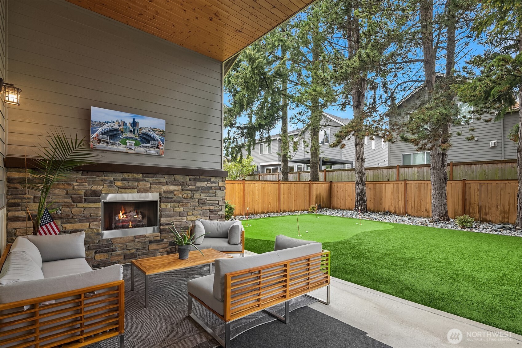 1435 242nd Place Southeast Bothell, WA 98021 - Photo 6 of 40 a backyard of a house with table and chairs