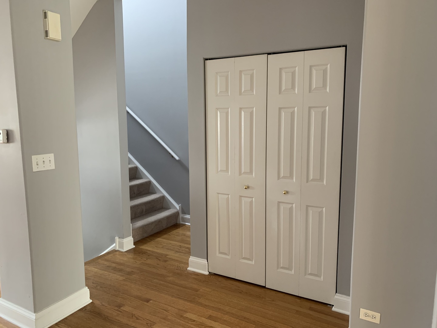 3442 Ravinia Circle Aurora, IL 60504 - Photo 11 of 18 an empty room with wooden floor and entryway