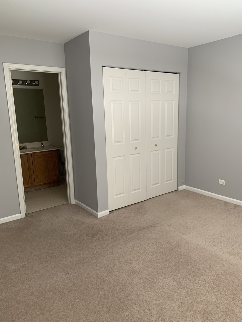 3442 Ravinia Circle Aurora, IL 60504 - Photo 17 of 18 a view of an empty room and a window