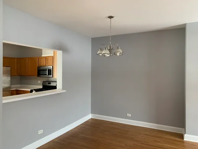 a view of a kitchen with stove and microwave