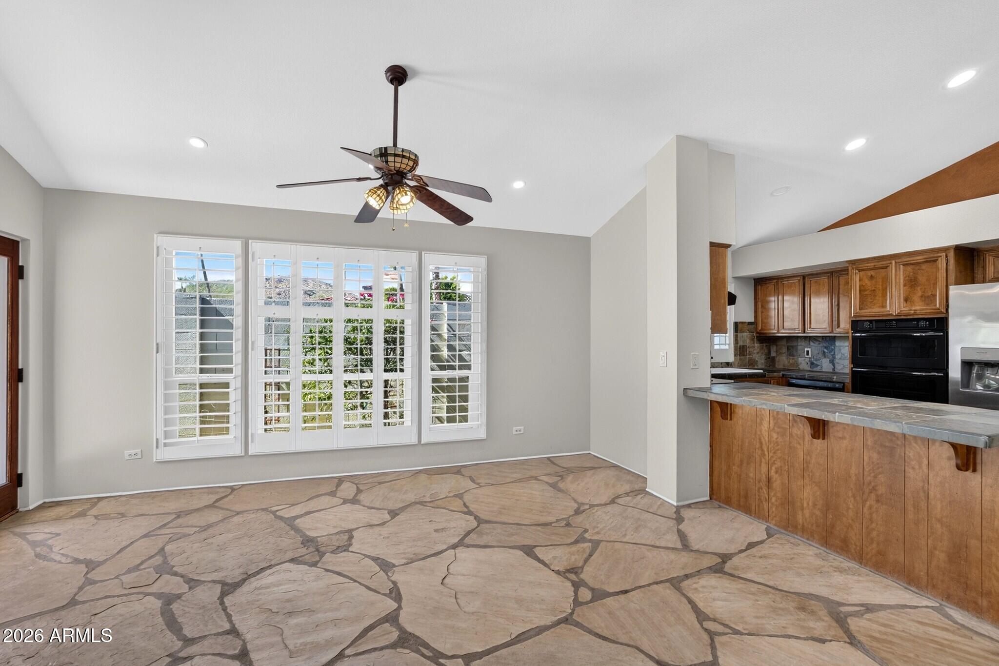 4615 East Monte Way Phoenix, AZ 85044 - Photo 32 of 35 a view of a kitchen with microwave and windows