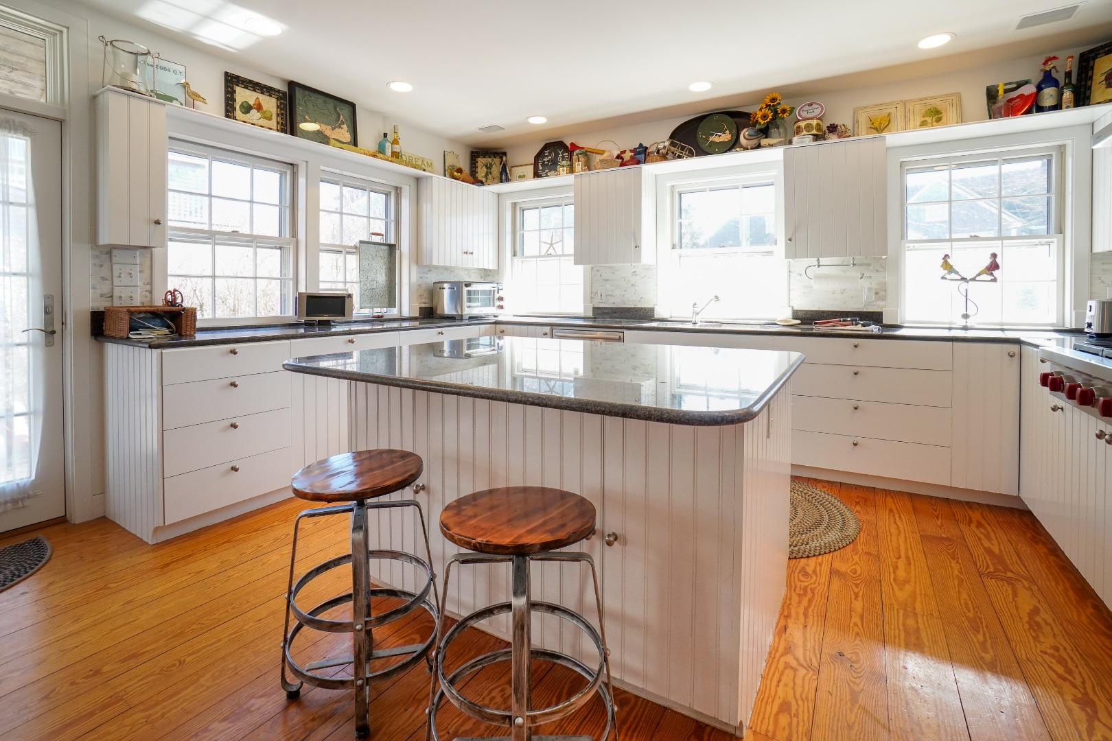 36 Cliff Road Nantucket, MA 02554 - Photo 7 of 15 a kitchen with a sink a window and cabinets