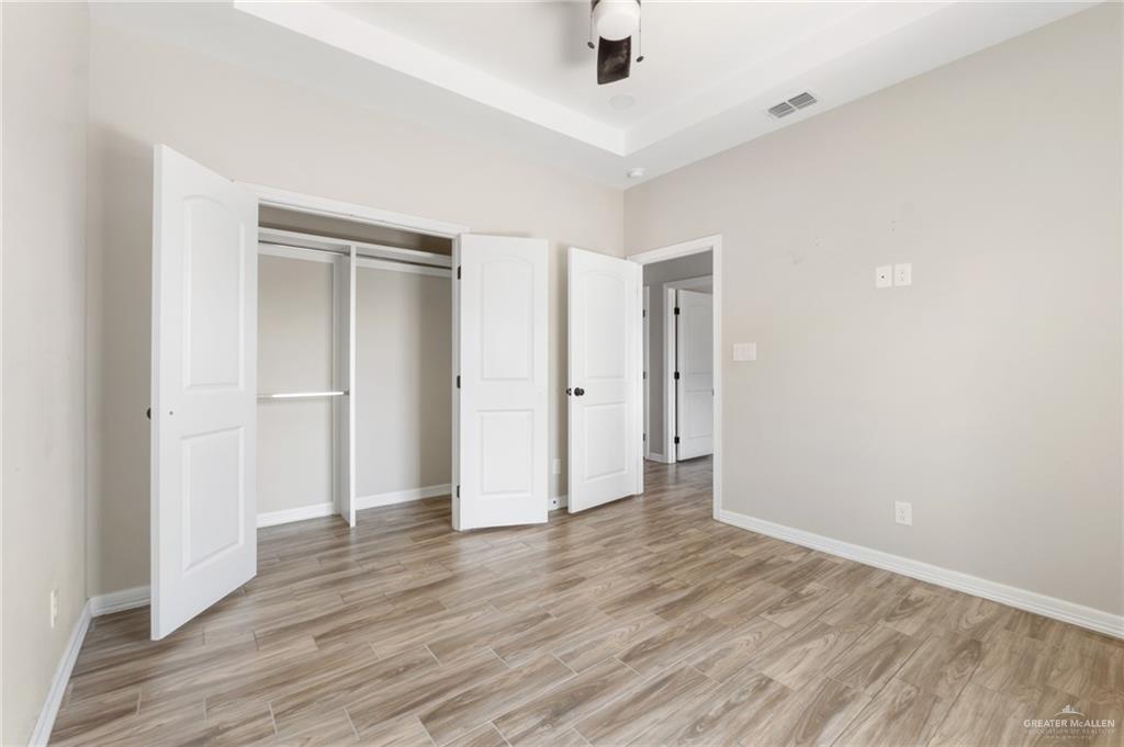 437 5th Street La Joya, TX 78560 - Photo 5 of 9 a view of an empty room with wooden floor