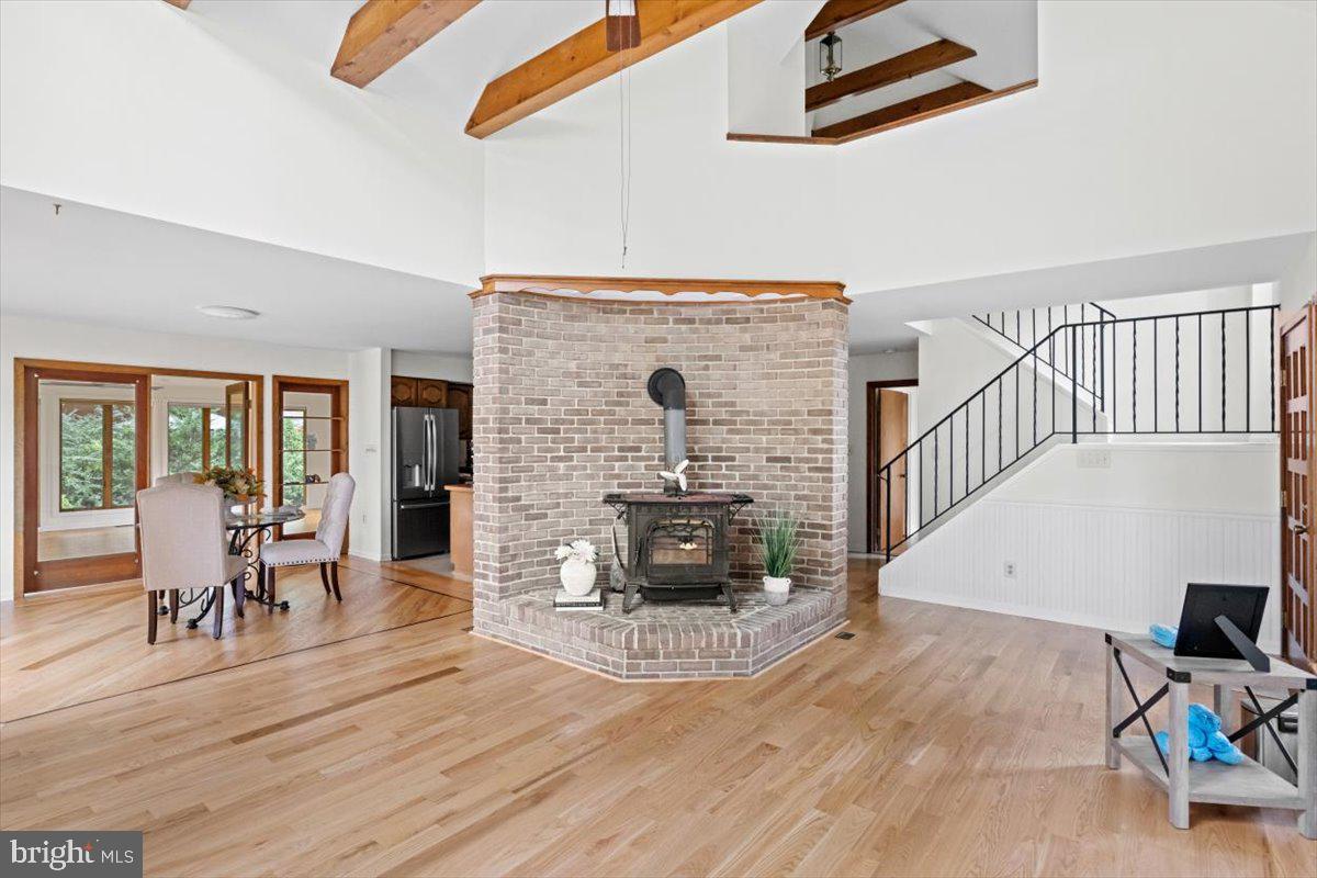 8403 Aubrey Drive Manassas, VA 20111 - Photo 9 of 30 Brick hearth & wood burning stove in living room