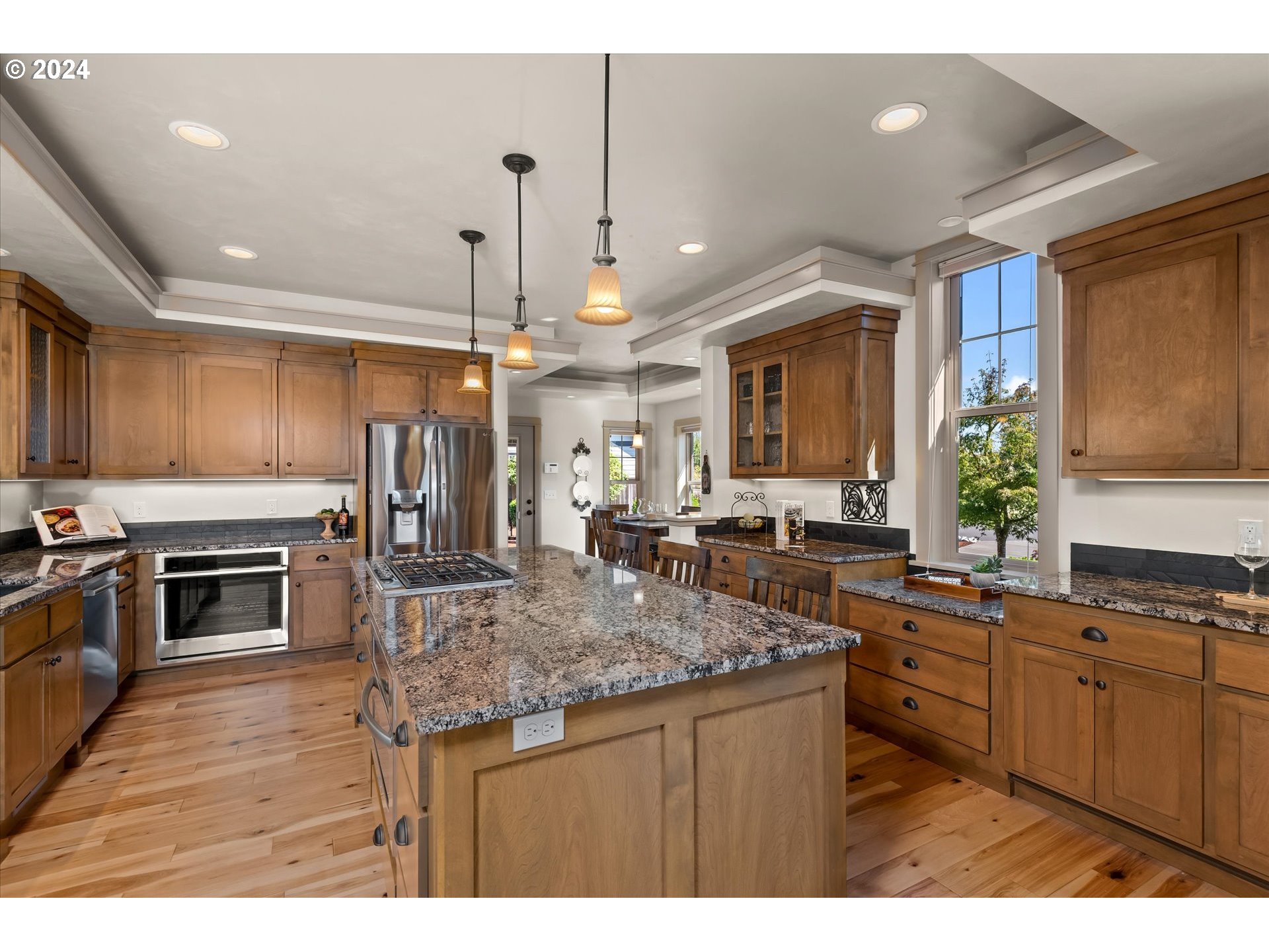 6019 Graystone Loop Springfield, OR 97478 - Photo 12 of 46 a kitchen with stainless steel appliances granite countertop a sink stove and refrigerator