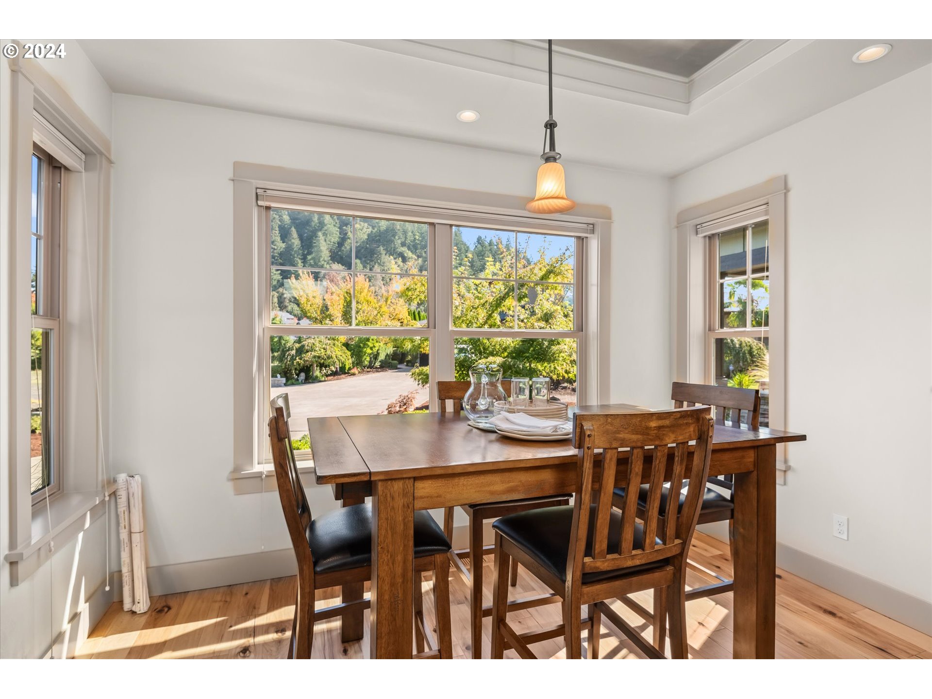 6019 Graystone Loop Springfield, OR 97478 - Photo 18 of 46 a view of a dining room with furniture window and outside view