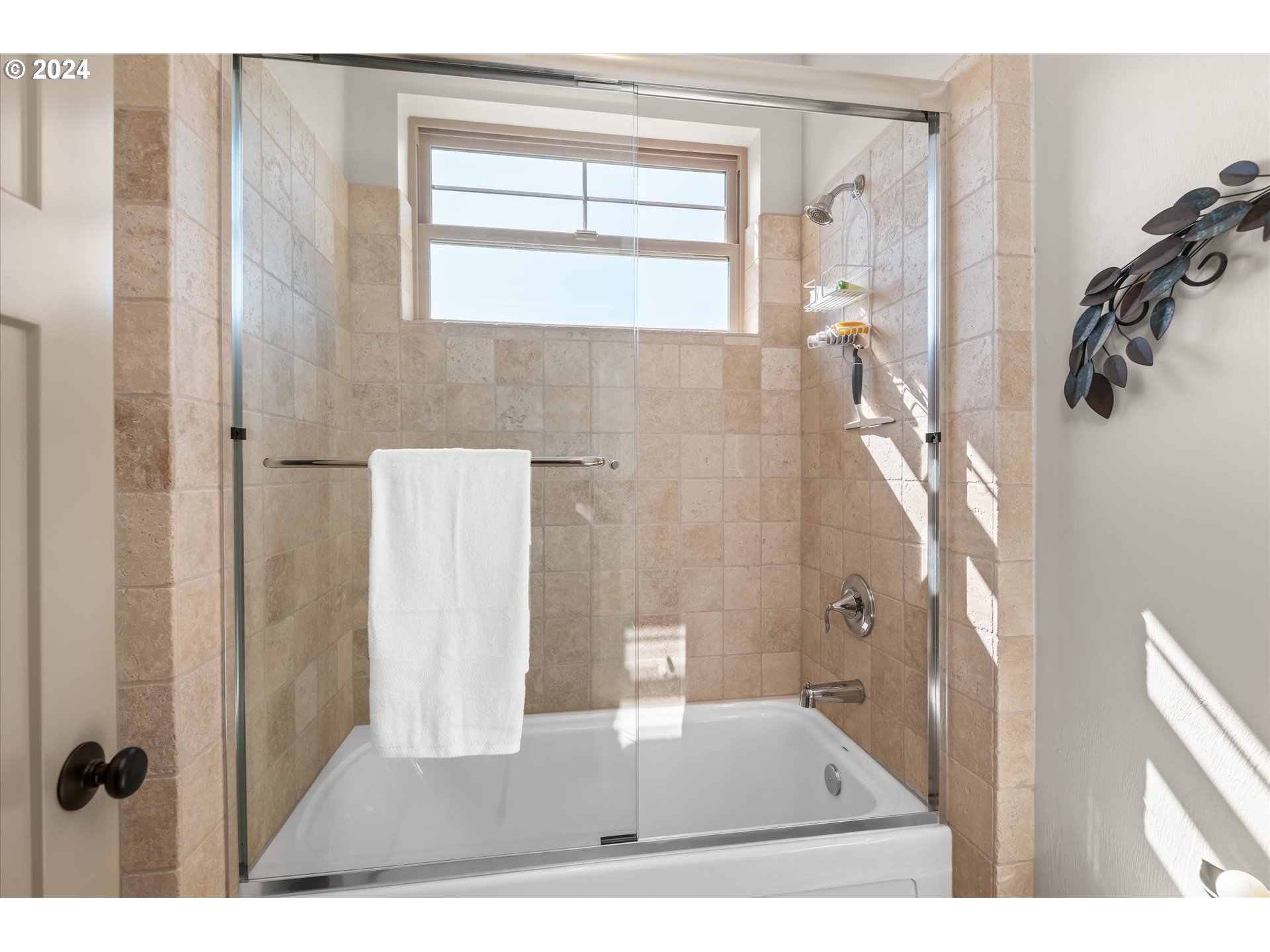 6019 Graystone Loop Springfield, OR 97478 - Photo 22 of 46 a bathroom with a glass shower door
