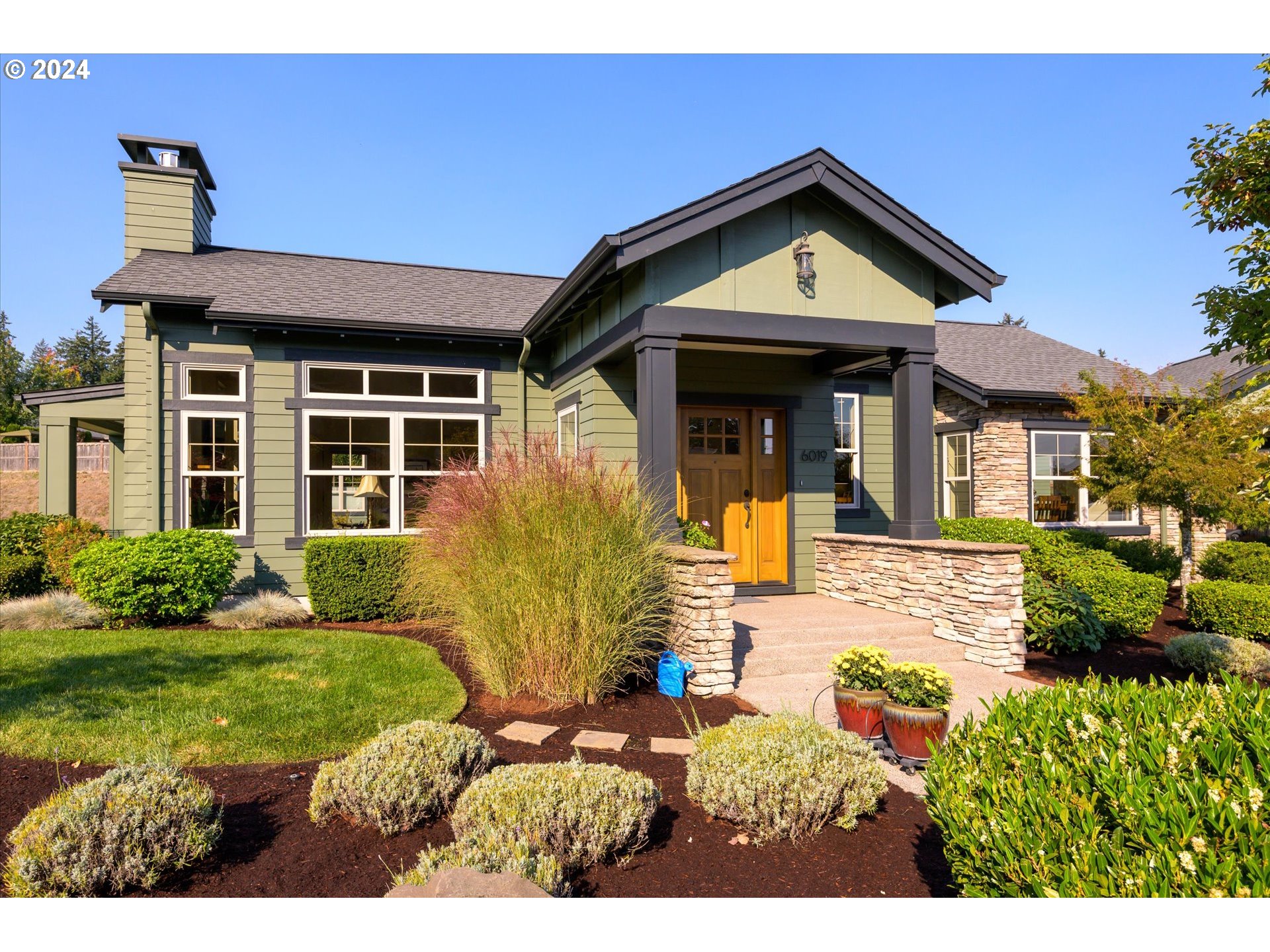 6019 Graystone Loop Springfield, OR 97478 - Photo 3 of 46 a front view of a house with garden
