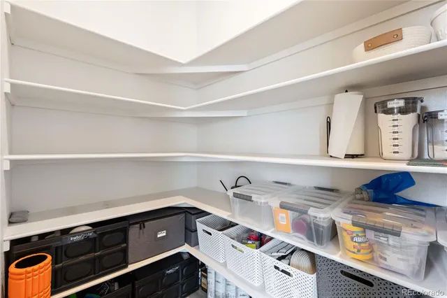 a view of storage and utility room with sink dryer and washer