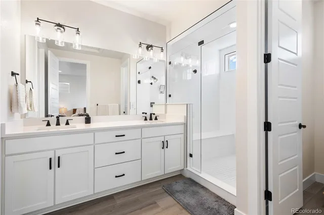 a spacious bathroom with a double vanity sink mirror and double