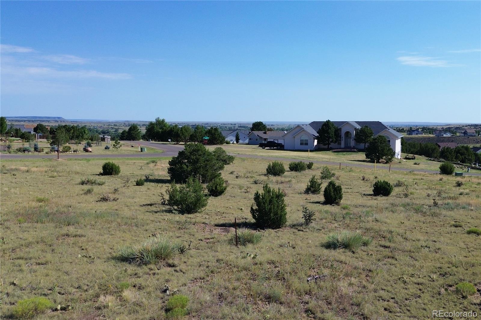 Pinon Terrace Trinidad, CO 81082 - Photo 7 of 26 a view of a dry yard with wooden fence