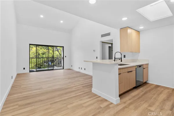 a spacious bathroom with a double vanity sink and a large mirror