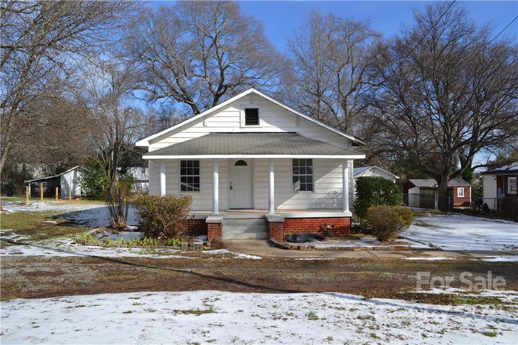 489 Union Cemetery Road Southwest Concord, NC 28027 - Photo 1 of 19 a front view of a house with garden