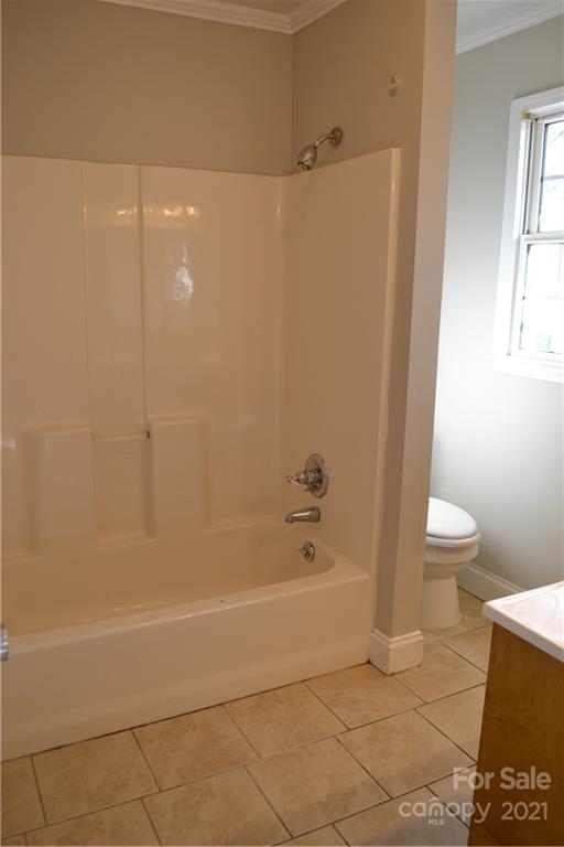 489 Union Cemetery Road Southwest Concord, NC 28027 - Photo 12 of 19 a bathroom with a shower and a bathtub