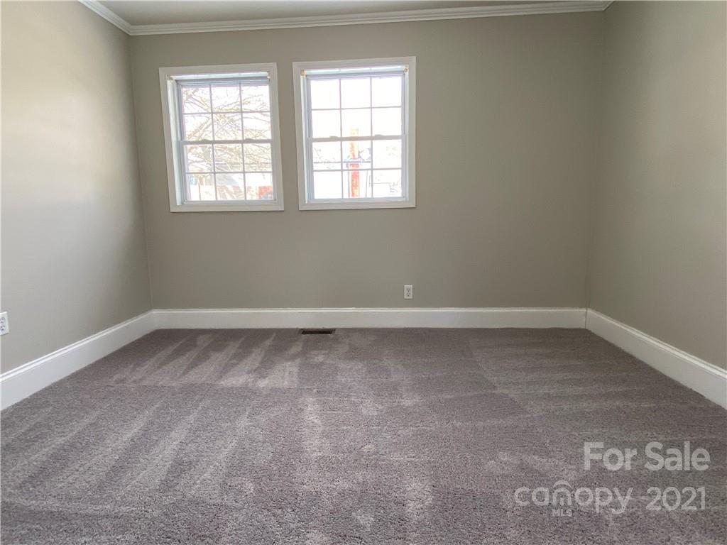 489 Union Cemetery Road Southwest Concord, NC 28027 - Photo 13 of 19 an empty room with a window
