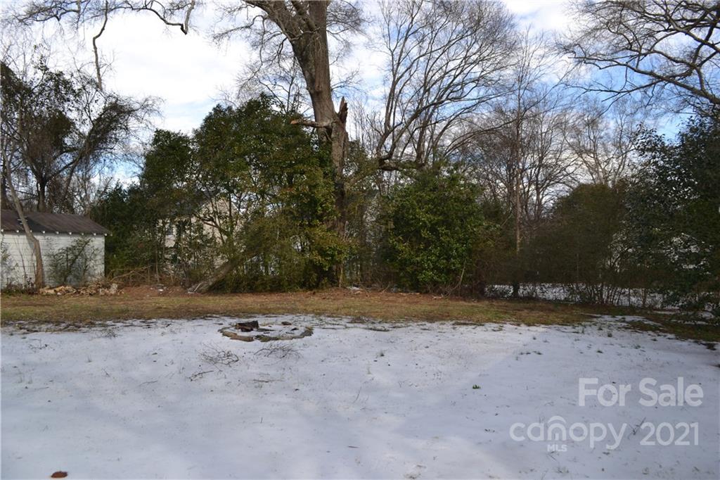 489 Union Cemetery Road Southwest Concord, NC 28027 - Photo 15 of 19 a view of a dry yard with trees