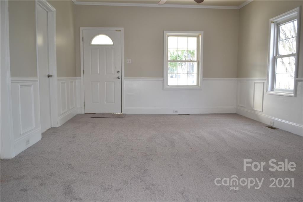 489 Union Cemetery Road Southwest Concord, NC 28027 - Photo 3 of 19 an empty room with windows