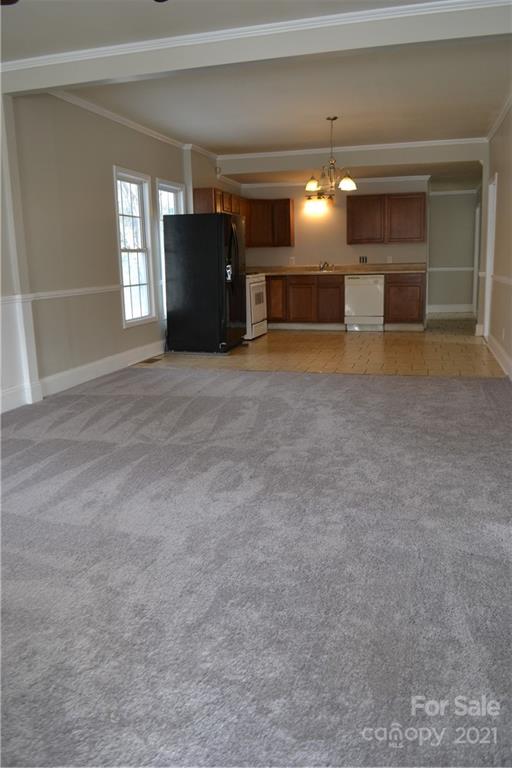 489 Union Cemetery Road Southwest Concord, NC 28027 - Photo 4 of 19 a view of a livingroom with furniture and chandelier