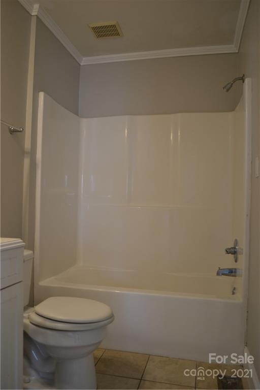489 Union Cemetery Road Southwest Concord, NC 28027 - Photo 8 of 19 a bathroom with a toilet and a bathtub