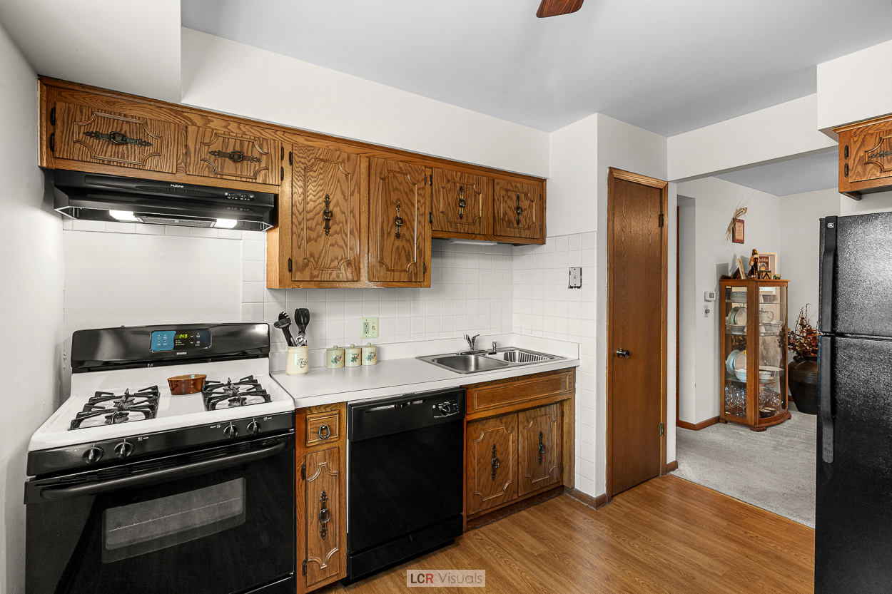 7616 West Lawrence Avenue, Unit 2B Harwood Heights, IL 60706 - Photo 5 of 15 a kitchen with stainless steel appliances granite countertop a stove and a refrigerator