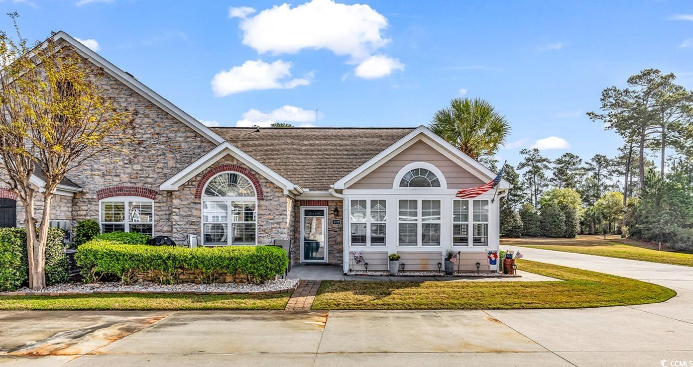 109 Stonegate Boulevard, Unit 109 Murrells Inlet, SC 29576 - Photo 1 of 39 View of front of property featuring stone siding a