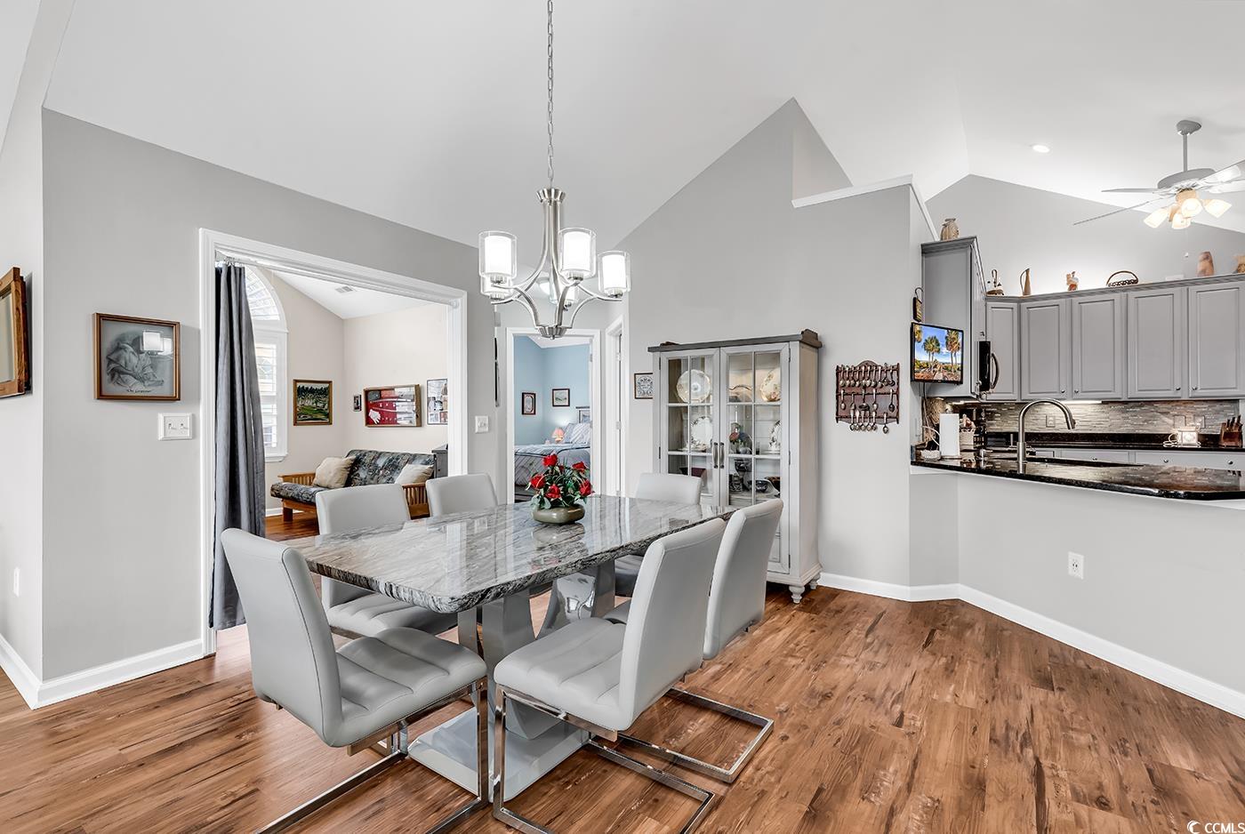 109 Stonegate Boulevard, Unit 109 Murrells Inlet, SC 29576 - Photo 12 of 39 Dining room featuring ceiling fan with notable cha