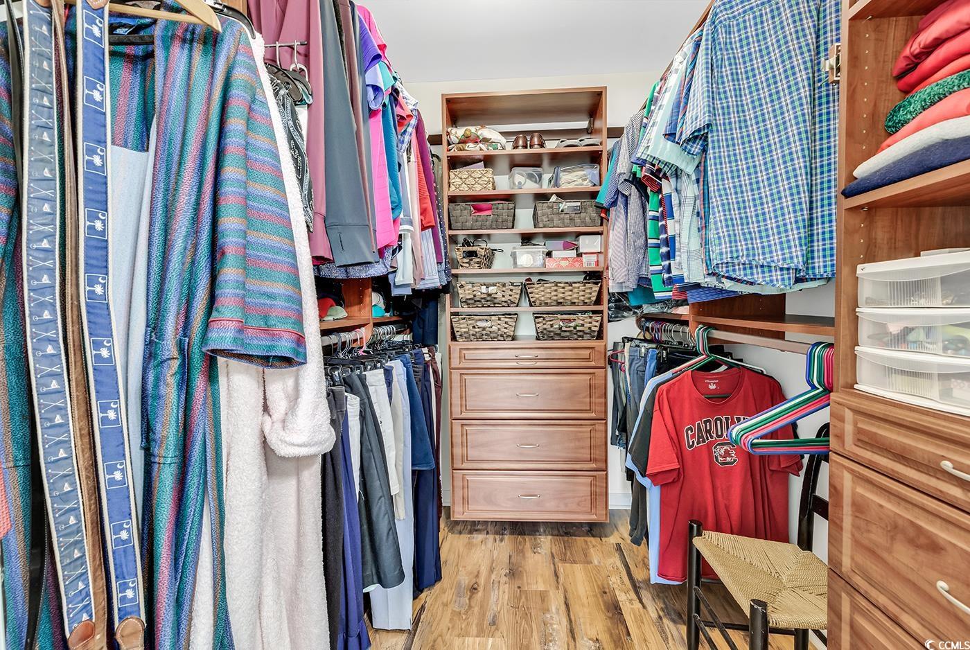109 Stonegate Boulevard, Unit 109 Murrells Inlet, SC 29576 - Photo 22 of 39 Walk in closet with light wood finished floors