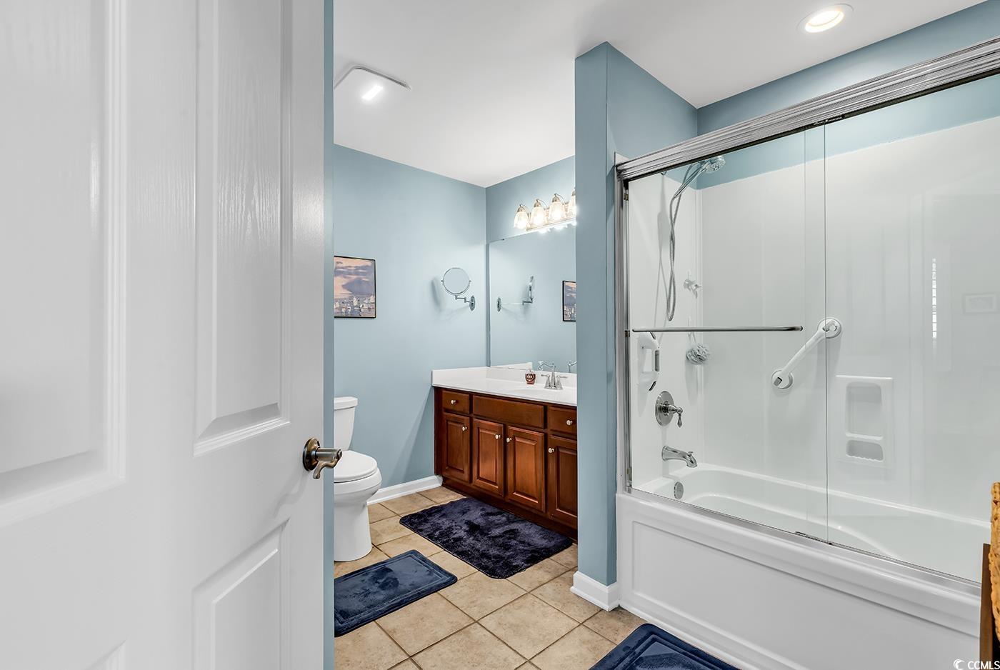 109 Stonegate Boulevard, Unit 109 Murrells Inlet, SC 29576 - Photo 25 of 39 Bathroom with vanity, toilet, baseboards, tile pat