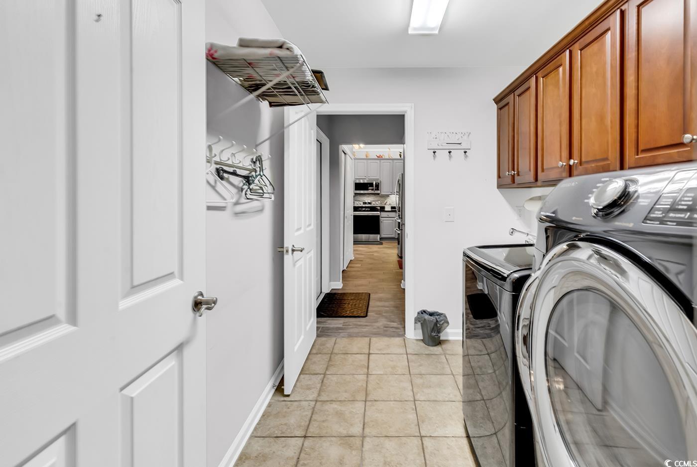 109 Stonegate Boulevard, Unit 109 Murrells Inlet, SC 29576 - Photo 27 of 39 Laundry room with light tile patterned flooring, c