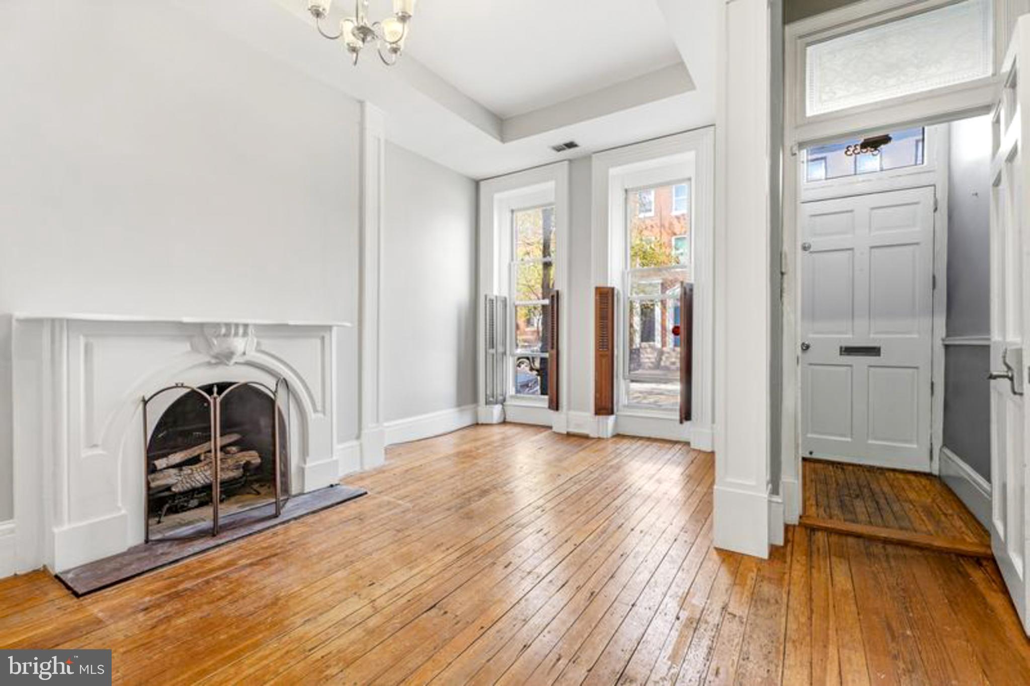 2033 East Pratt Street Baltimore, MD 21231 - Photo 12 of 61 a view of a livingroom with a patio and a fireplace