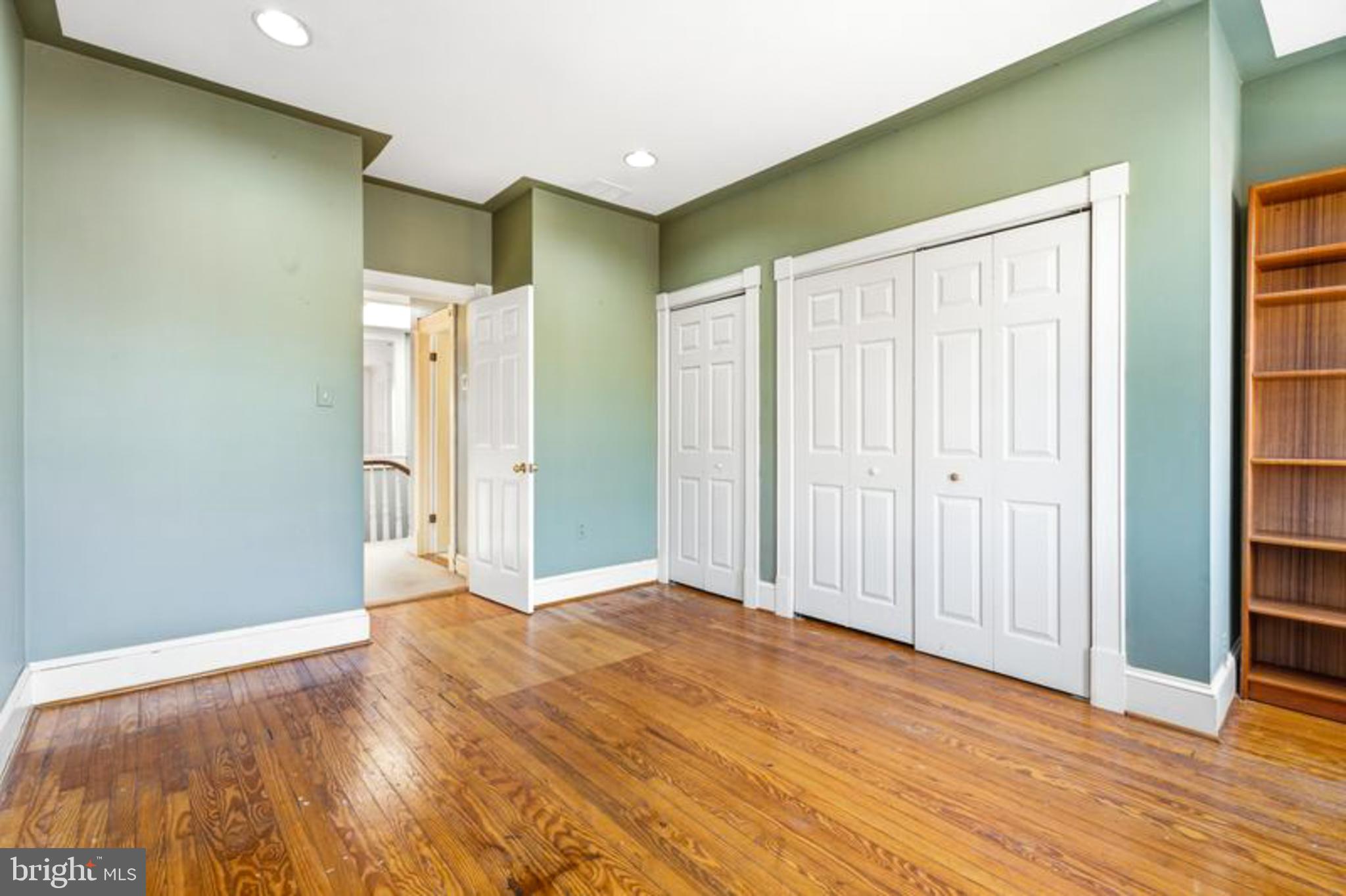 2033 East Pratt Street Baltimore, MD 21231 - Photo 26 of 61 an empty room with wooden floor and closet