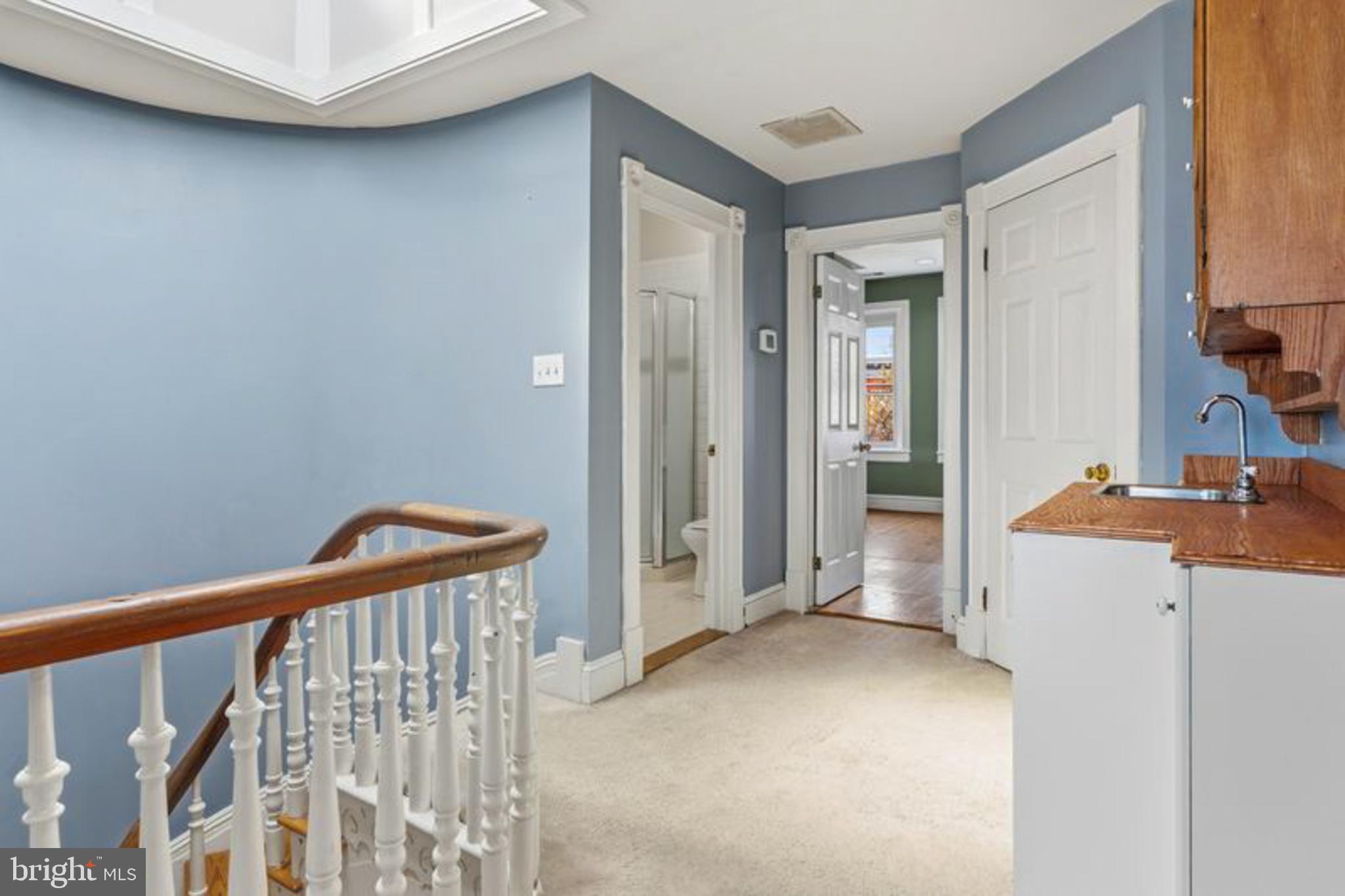 2033 East Pratt Street Baltimore, MD 21231 - Photo 37 of 61 a view of a hallway and a kitchen with a sink