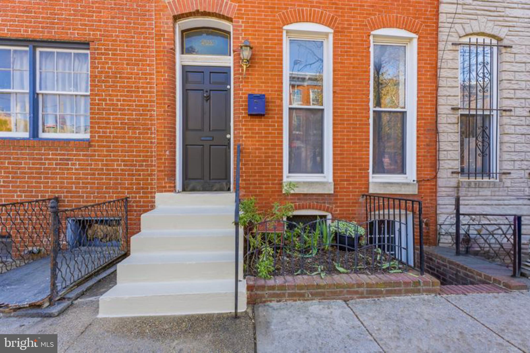 2033 East Pratt Street Baltimore, MD 21231 - Photo 4 of 61 a view of brick house with a large windows