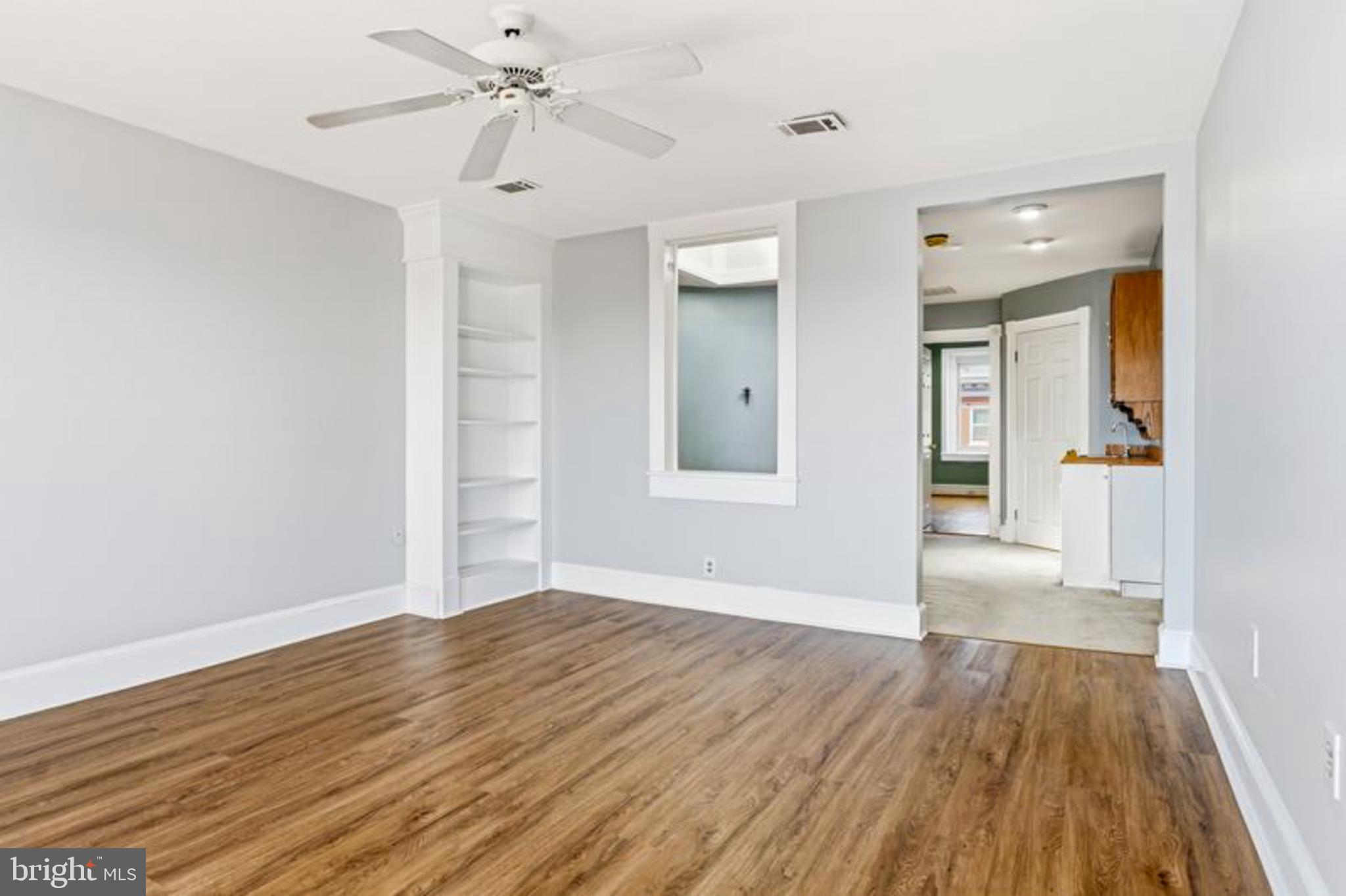 2033 East Pratt Street Baltimore, MD 21231 - Photo 46 of 61 a view of an empty room with wooden floor