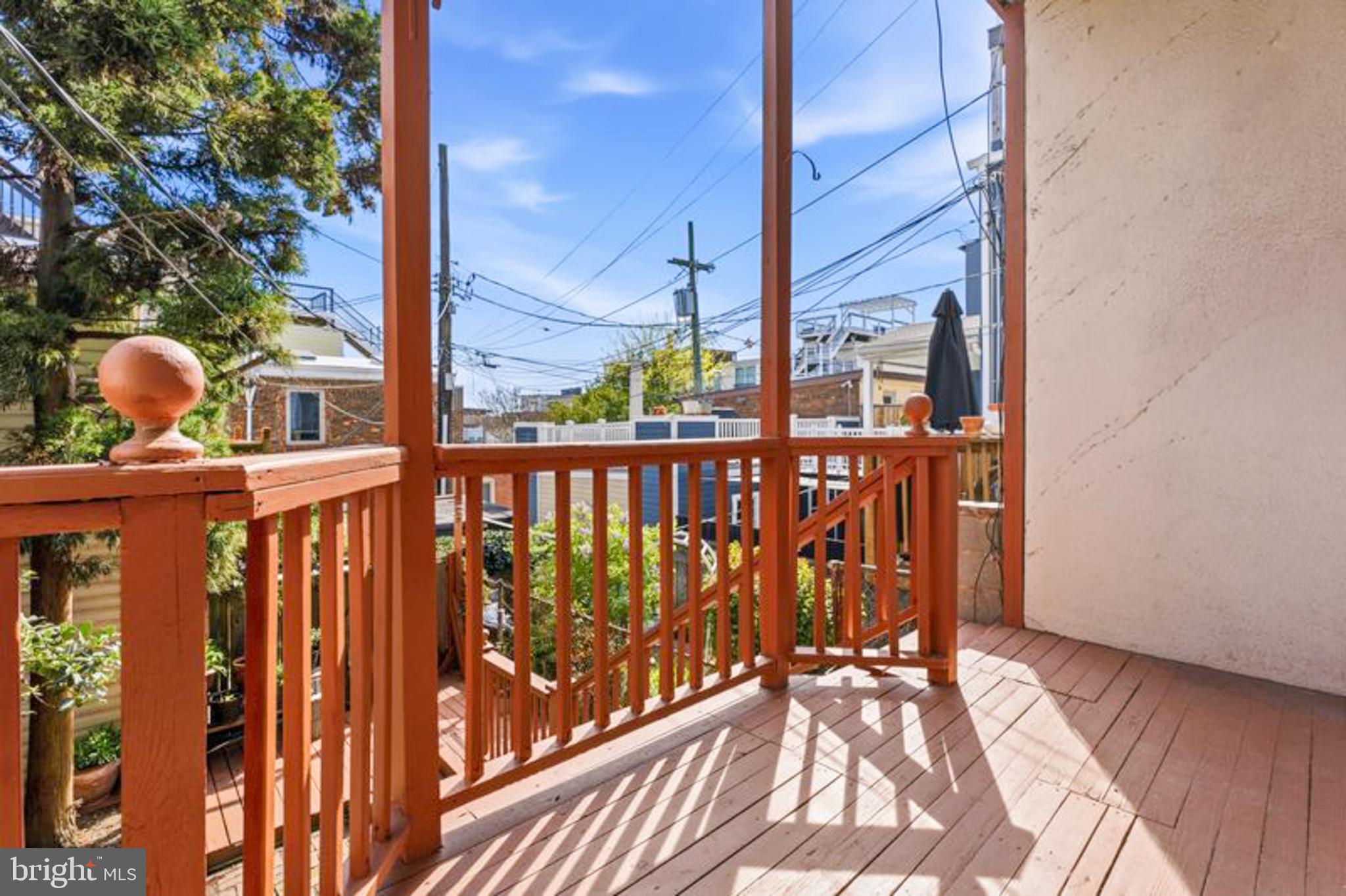 2033 East Pratt Street Baltimore, MD 21231 - Photo 51 of 61 a view of a balcony with wooden floor
