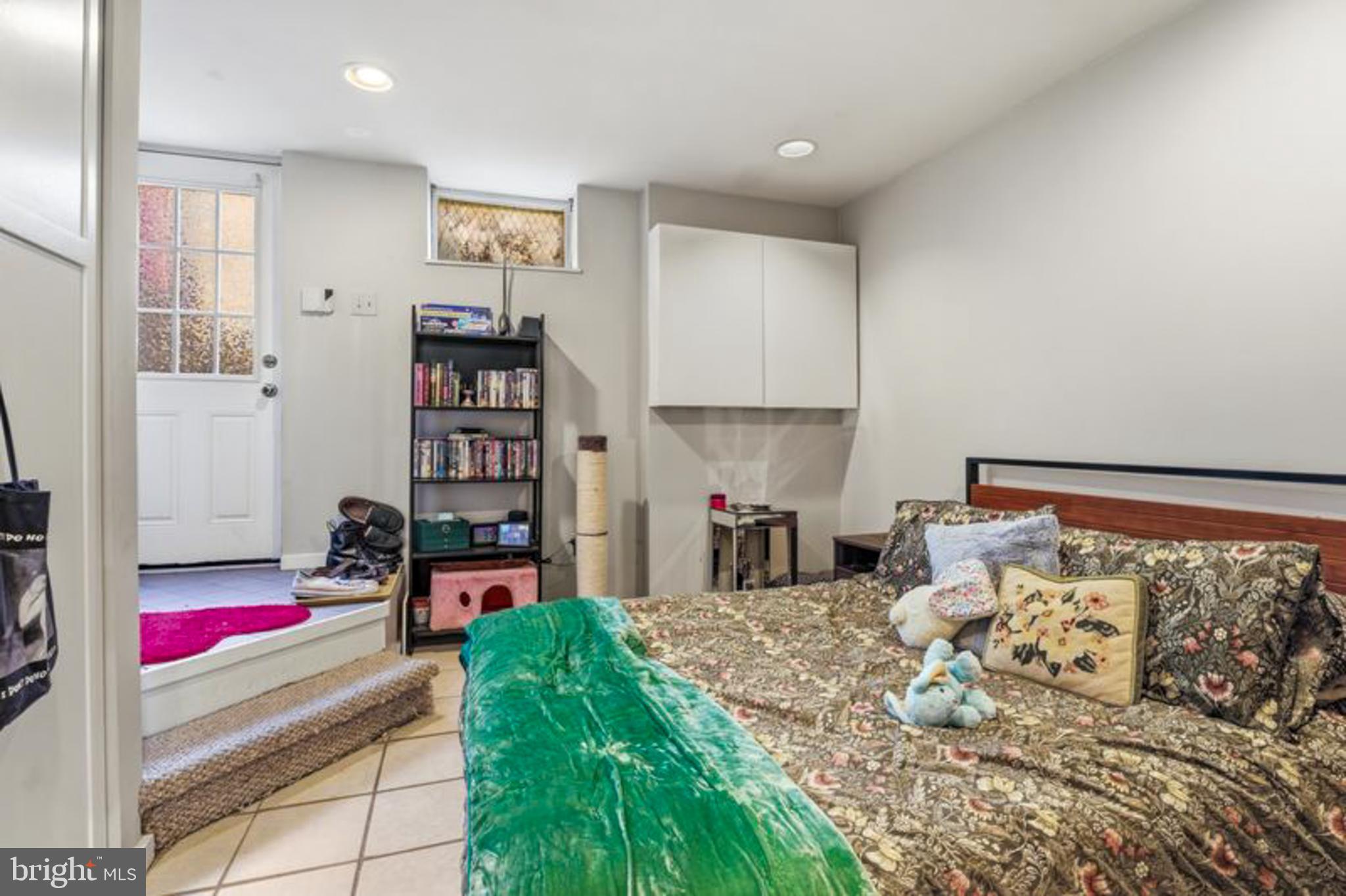 2033 East Pratt Street Baltimore, MD 21231 - Photo 60 of 61 a bedroom with furniture and a bed